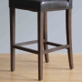 Tabouret de bar haut avec dossier en simili cuir noir